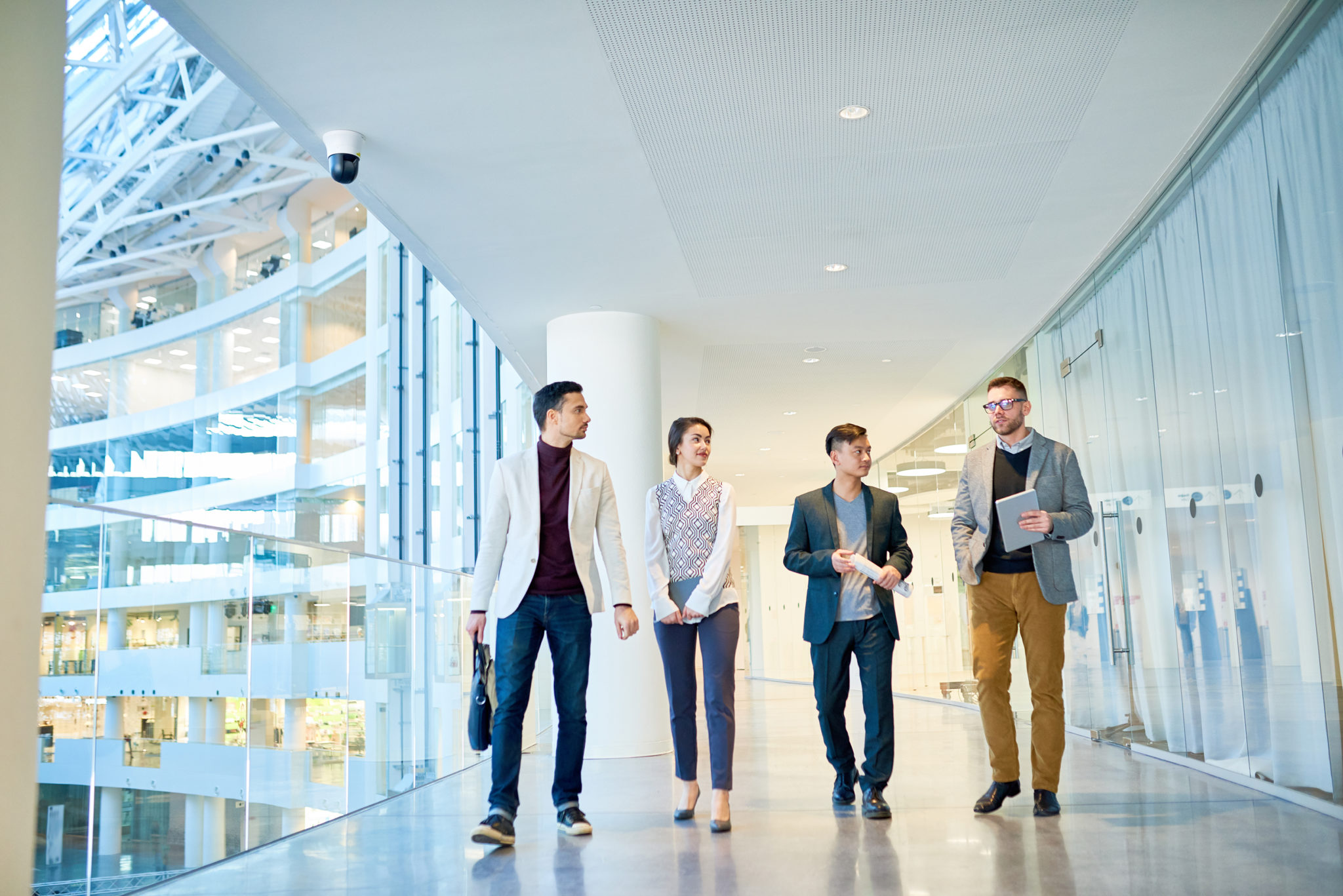 Professional services - people walking in modern building